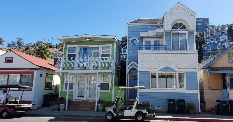 Golf carts and colorful houses - Photo by Mar Yvette