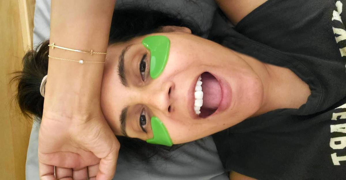 Best vegan skincare brands: Mar wearing 100% Pure's green eye masks
